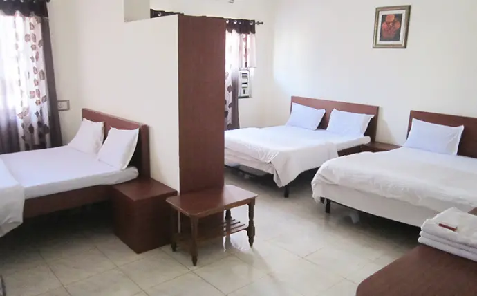 Family Room (6 Beds) – ₹4079   A premium room for large families or pilgrim groups: